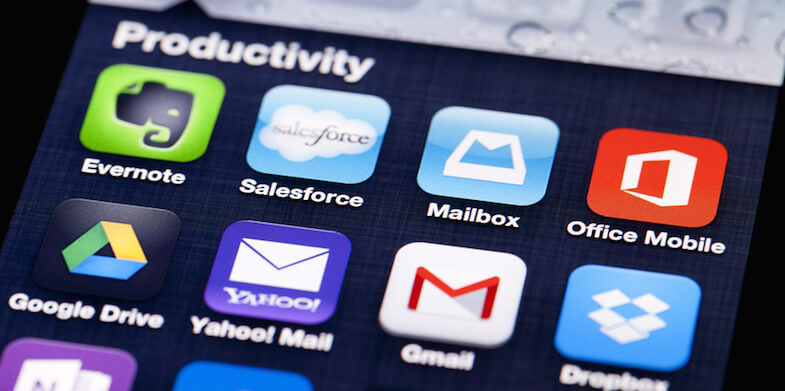 Close-up image of an iPhone screen with icons of productivity apps